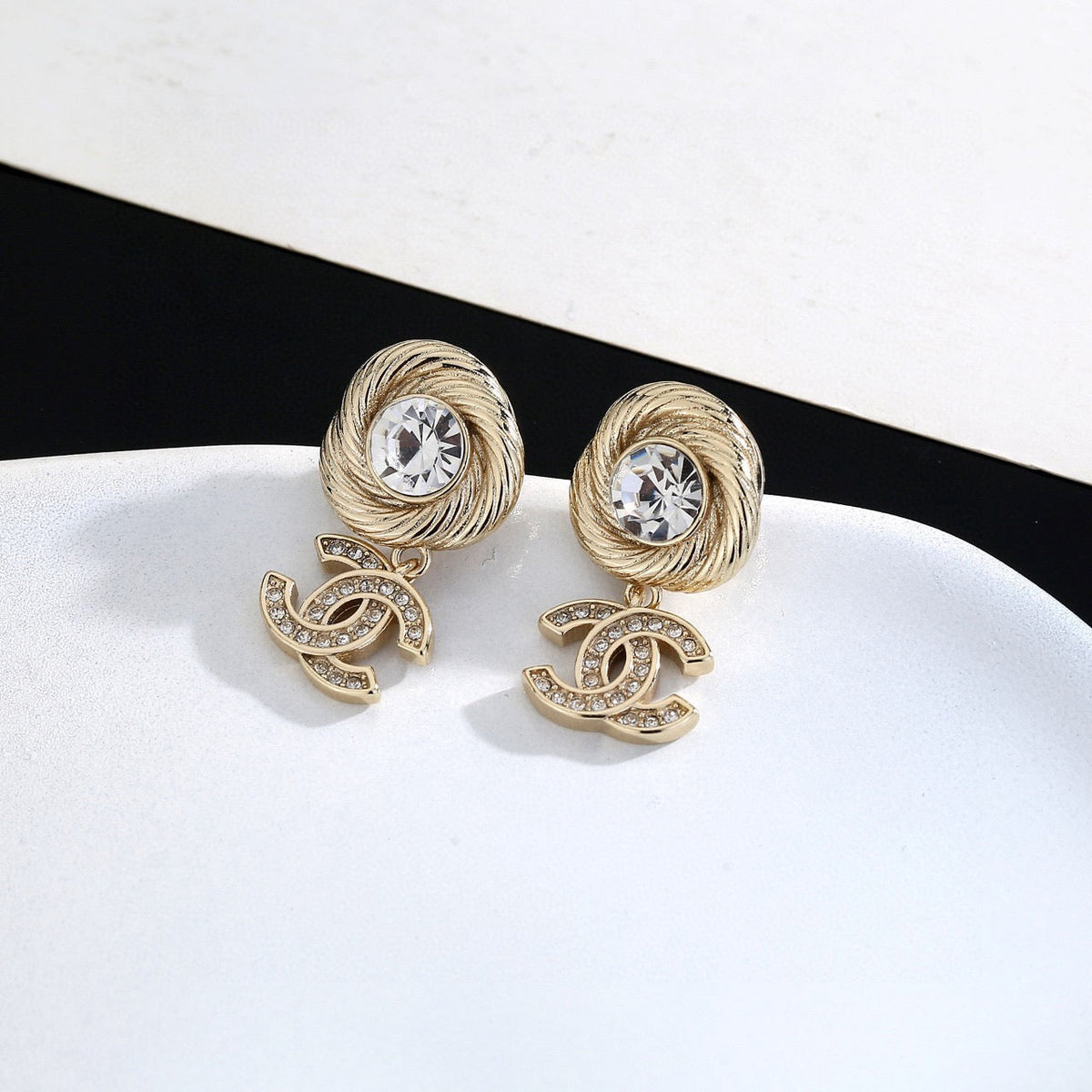 Martin Graham stud earrings in polished metal-tone – close-up detail