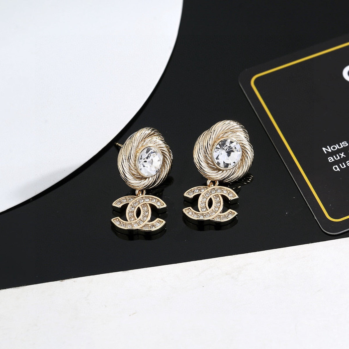 Martin Graham stud earrings in polished metal-tone – detail view