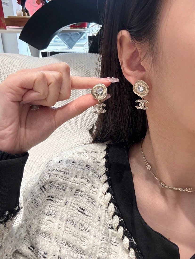 Martin Graham stud earrings in polished metal-tone – styled product view