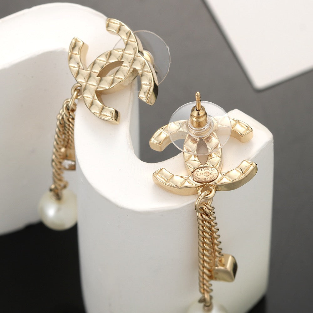 Martin Graham stud earrings in polished metal-tone – detail view