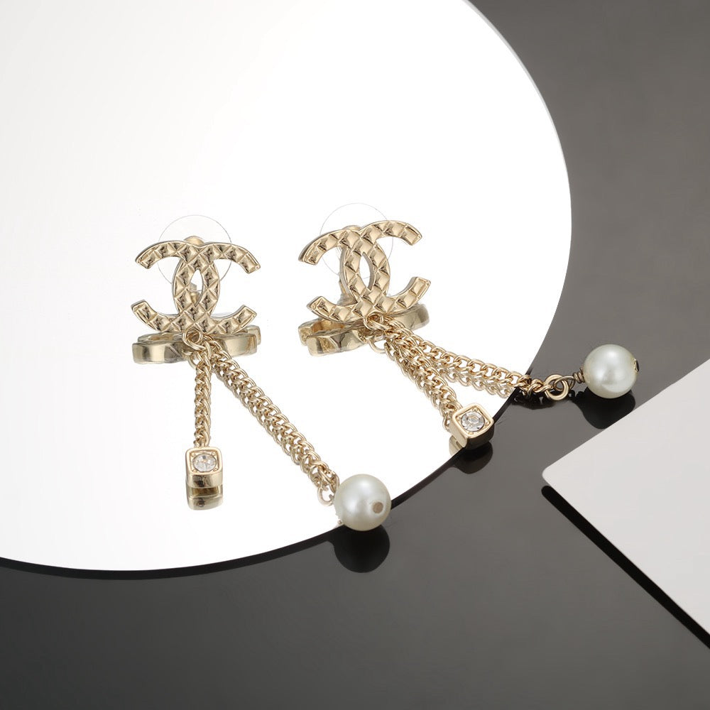 Martin Graham stud earrings in polished metal-tone – front product view
