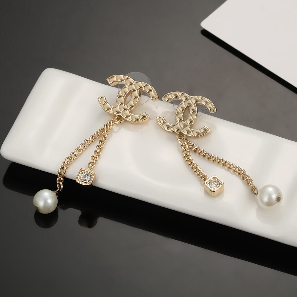 Martin Graham stud earrings in polished metal-tone – side detail