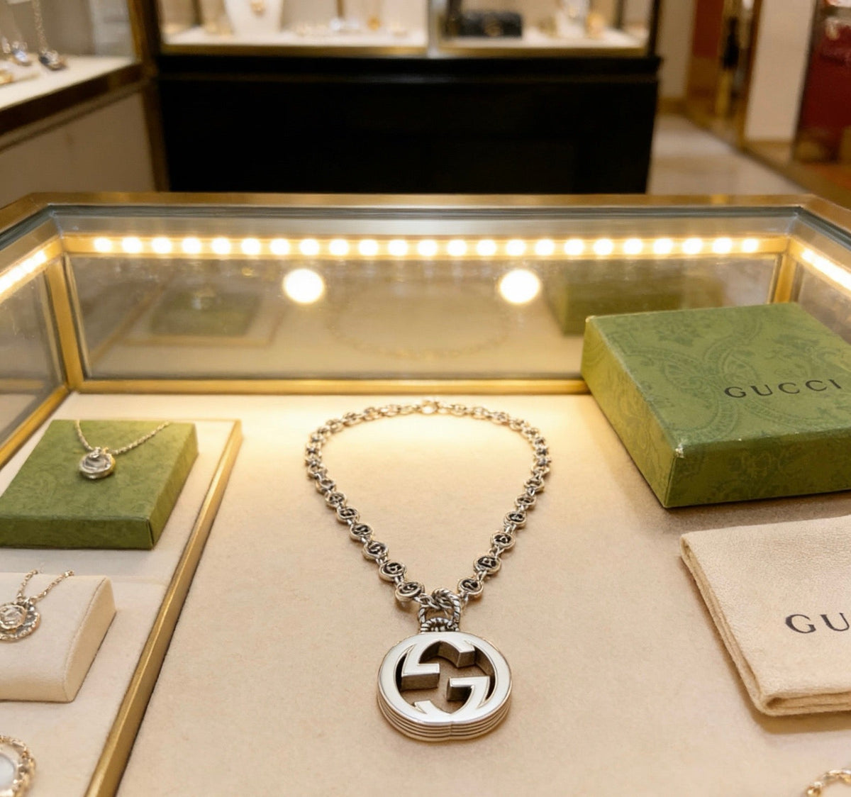 Martin Graham pendant necklace in polished metal-tone – detail view