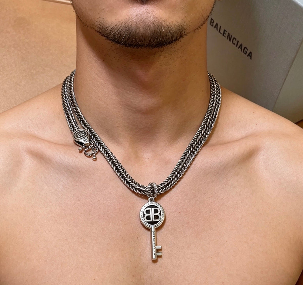 Martin Graham pendant necklace in polished metal-tone – detail view