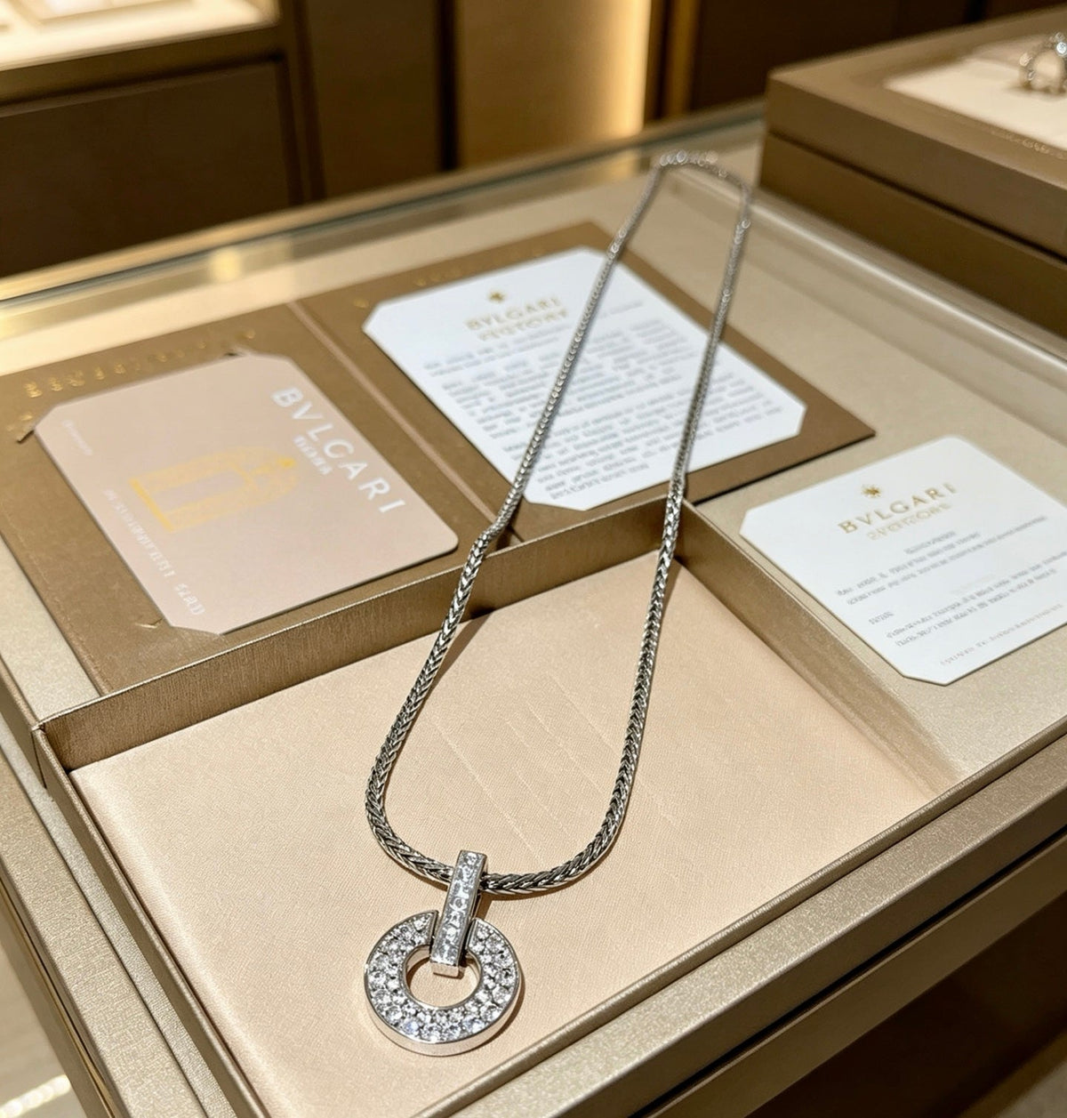 Martin Graham pendant necklace in polished metal-tone – close-up detail