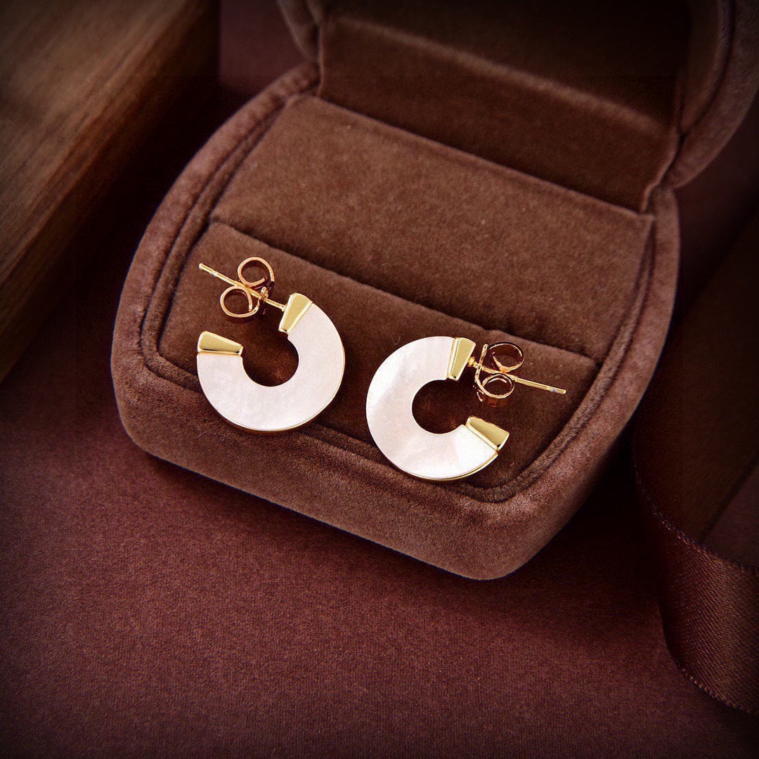 Martin Graham stud earrings in polished metal-tone – main product view