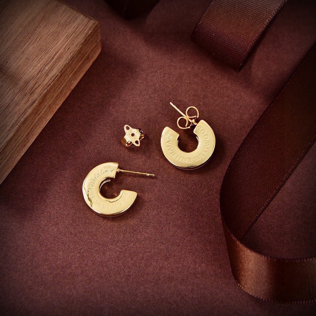 Martin Graham stud earrings in polished metal-tone – detail view