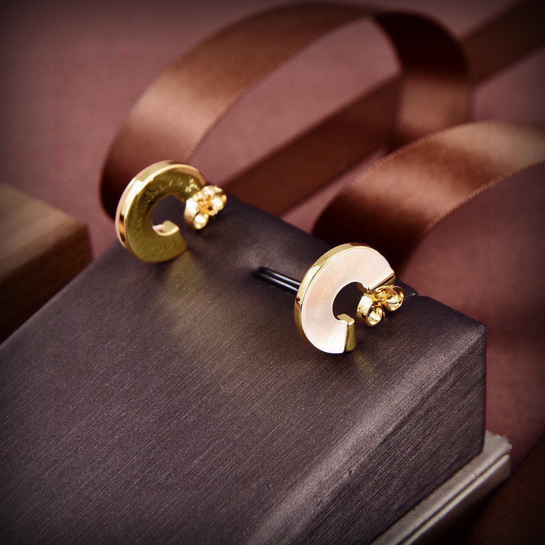 Martin Graham stud earrings in polished metal-tone – side detail