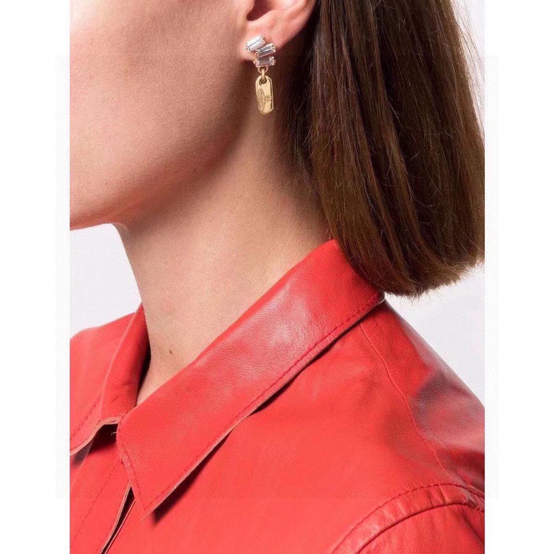 Martin Graham stud earrings in polished metal-tone – detail view