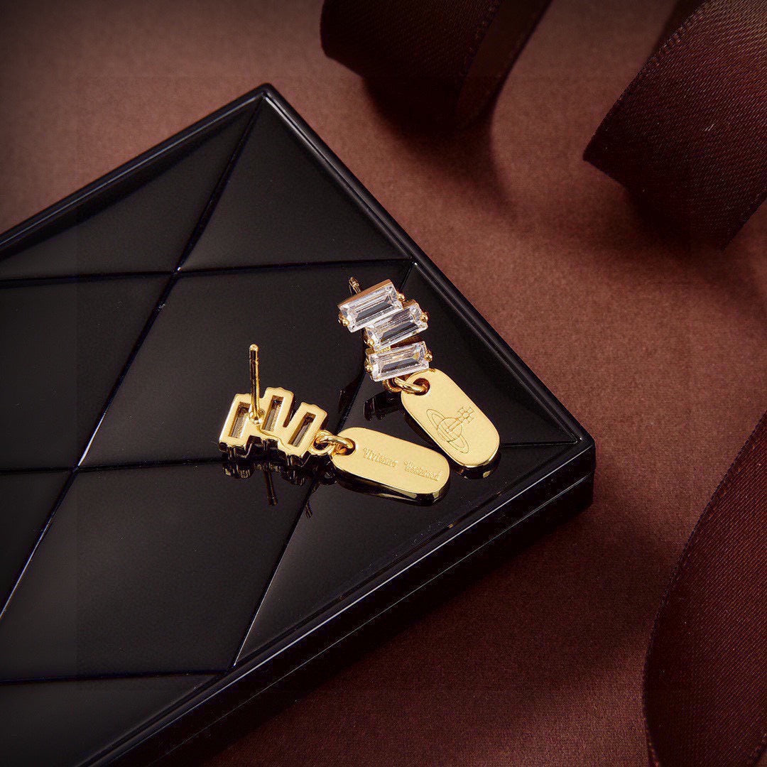 Martin Graham stud earrings in polished metal-tone – styled product view