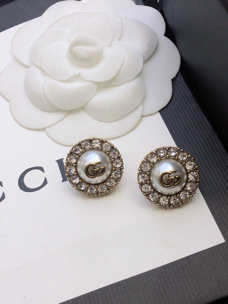 Martin Graham stud earrings in polished metal-tone – front product view