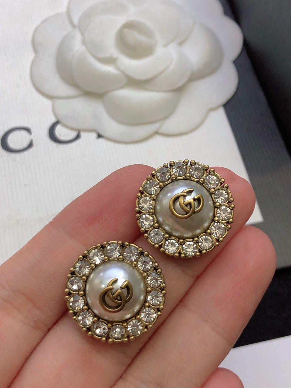 Martin Graham stud earrings in polished metal-tone – styled product view