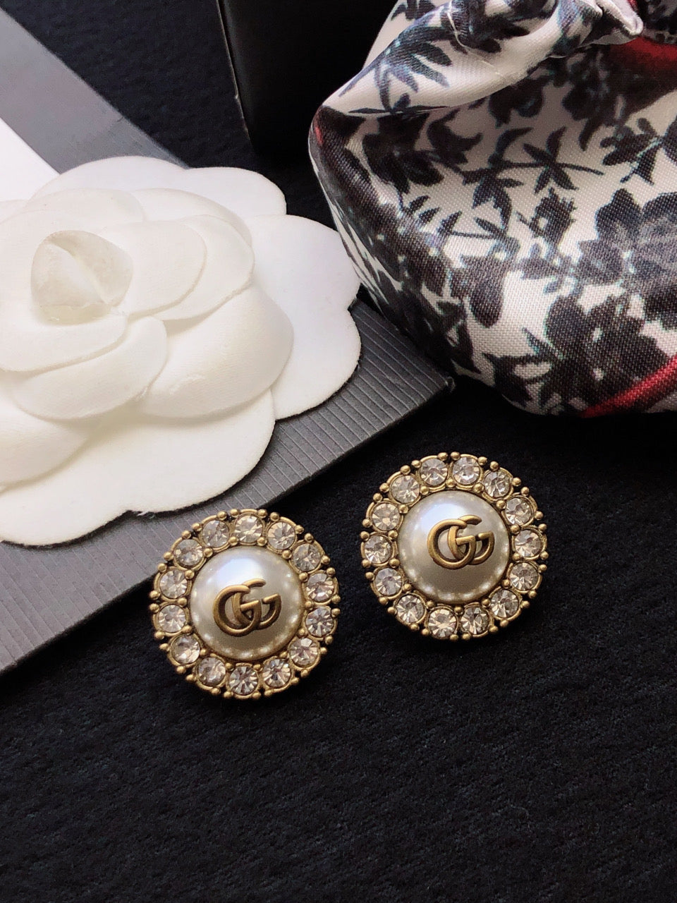 Martin Graham stud earrings in polished metal-tone – front product view