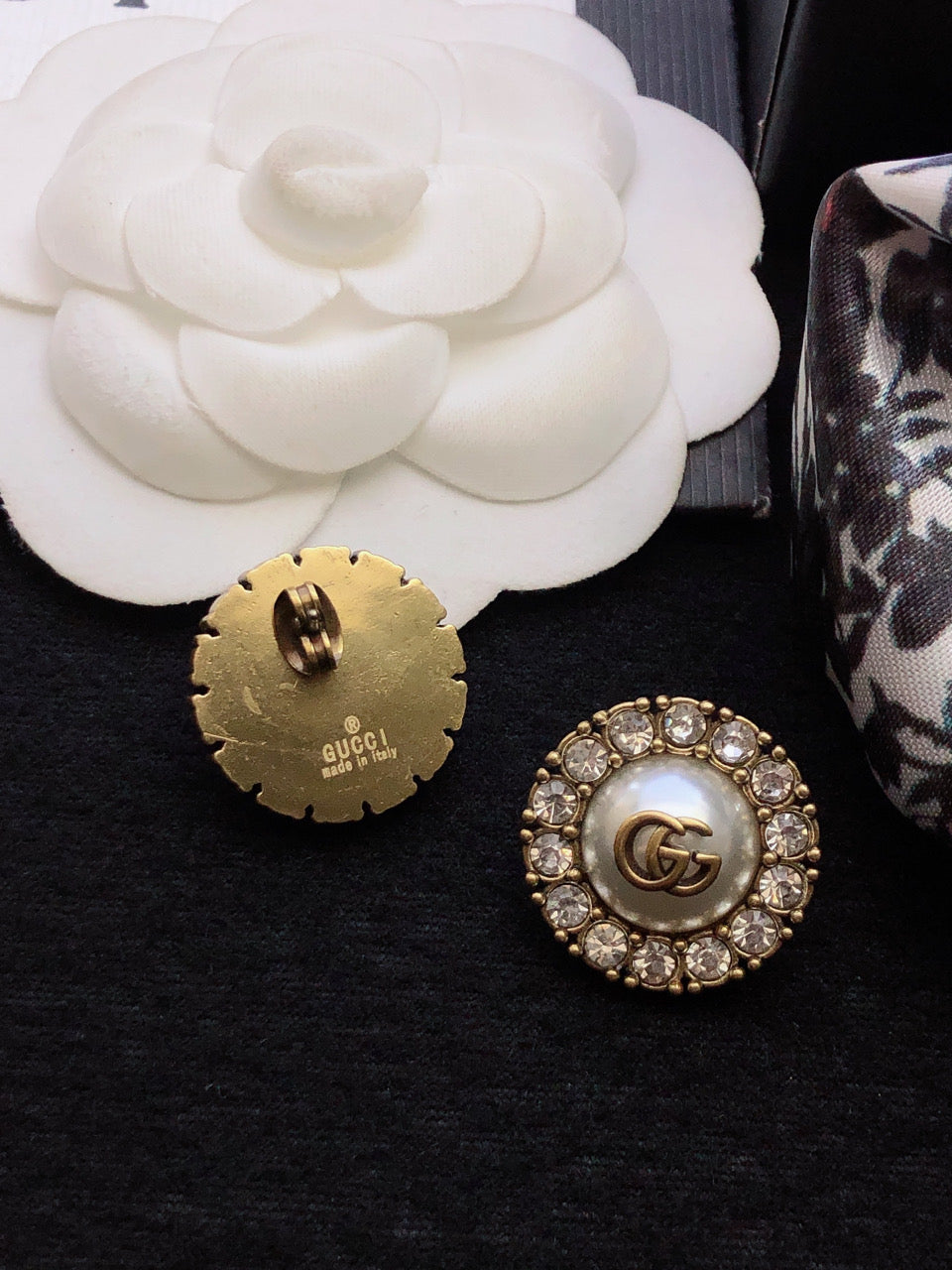 Martin Graham stud earrings in polished metal-tone – detail view