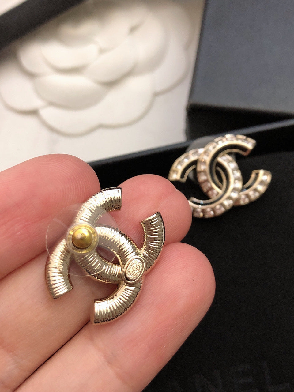 Martin Graham stud earrings in polished metal-tone – styled product view