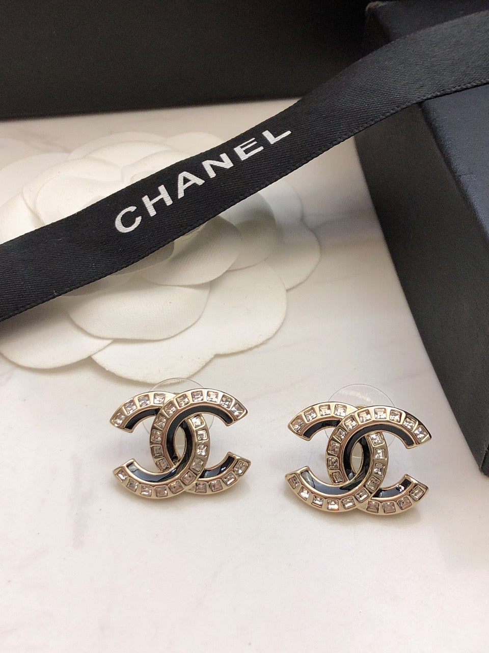 Martin Graham stud earrings in polished metal-tone – front product view