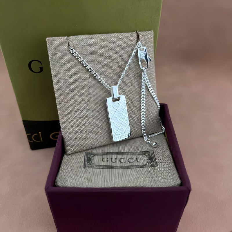 Martin Graham pendant necklace in polished metal-tone – detail view